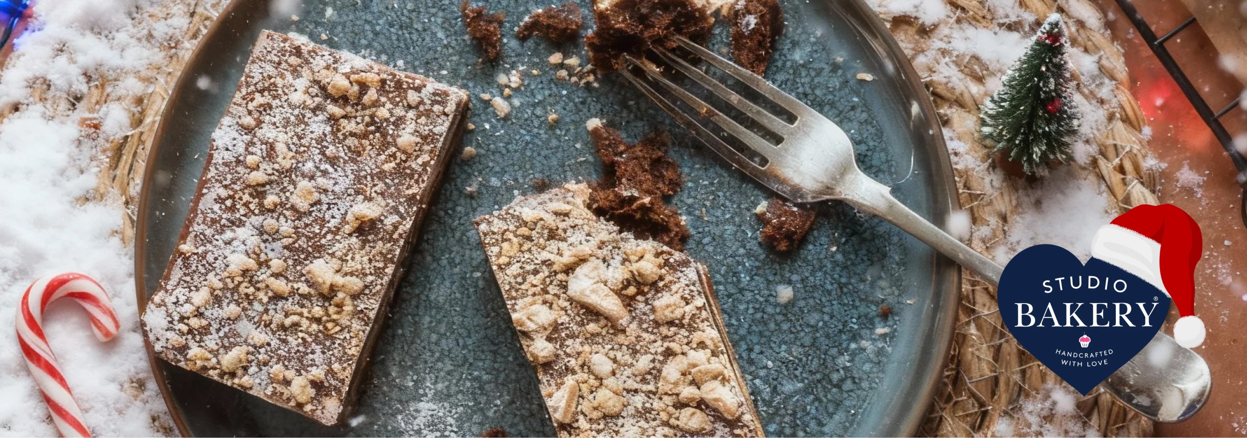 Festive brownie slice, on table with fake snow and tiny Christmas tree