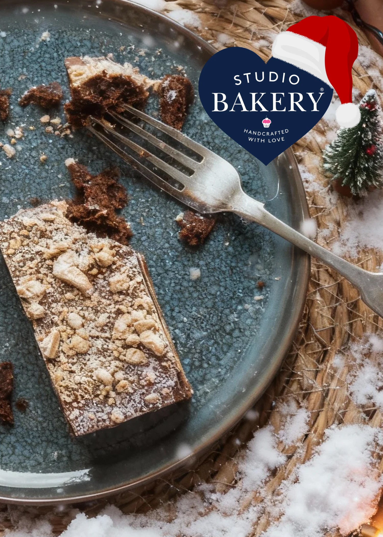 Festive brownie slice, on table with fake snow and tiny Christmas tree